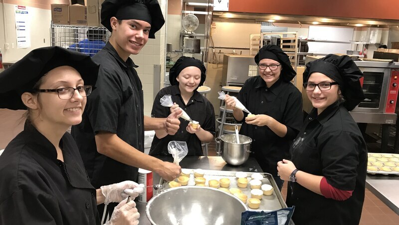 Culinary Arts students working in the lab.